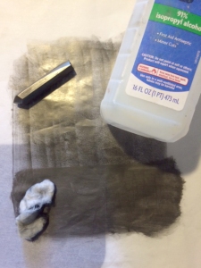 This is a small example of the technique to make graphite paper. It shows a  graphite 4B pencil, you can use regular pencils too, that has been used to lay down a fairly even layer of graphite. Below that is a cotton ball soaked in alcohol then used to distribute the graphite evenly over the surface.